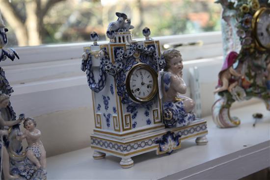 A Meissen figural mantel clock, late 19th century, height 30cm, tiny losses to flowers